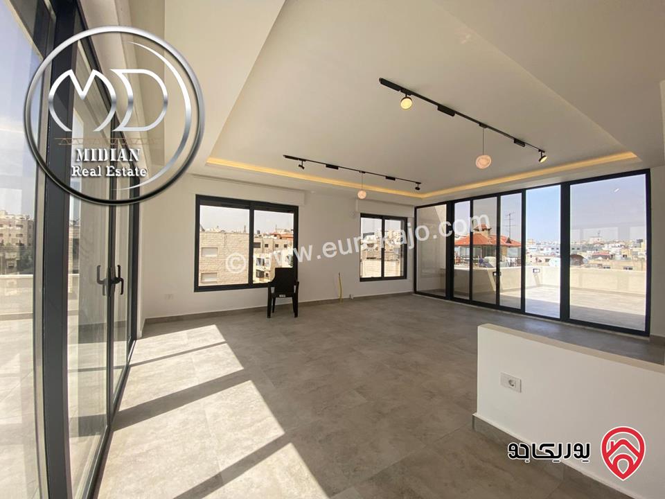 شقة دوبلكس جديدة طابق اخير مع روف للبيع في عمان - الجندويل مساحة 230م مع تراسات تشطيبات ديكورات عصرية اطلالة جميلة