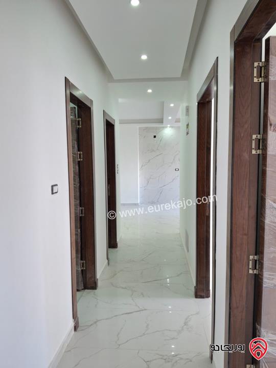 شقة جديدة طابق أول مساحة 170م للبيع في عمان - الرابية