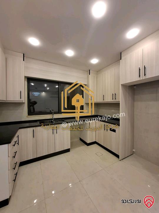 شقة جديدة طابق أرضي مع حديقة مساحه 150م داخلي 130م حديقة للايجار في عمان - الجندويل 