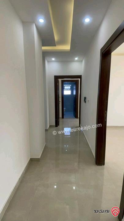 شقة جديدة طابق اول مساحة 140متر للإيجار في عمان - مرج الحمام 