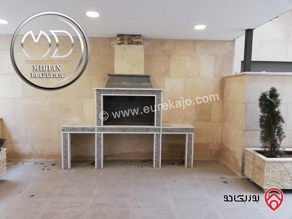 شقة ارضية مفروشة للايجار في عمان - ام السماق مساحة 130م مع ترس 100م تشطيبات و فرش سوبر ديلوكس