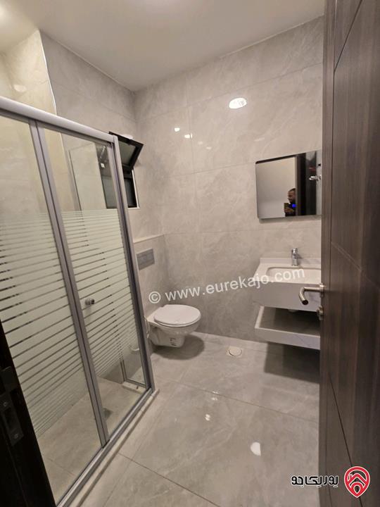 شقة أرضية مساحة 115م مع تراسات 90م للبيع في عمان - تلاع العلي