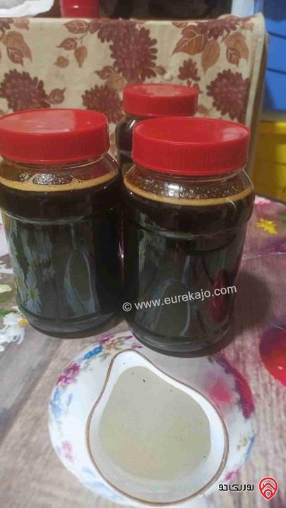 مزرعة مساحة 9 دونم مزروعة رمان و زيتون مرويه من خزان في نفس الارض للبيع في اربد - كفر سوم 