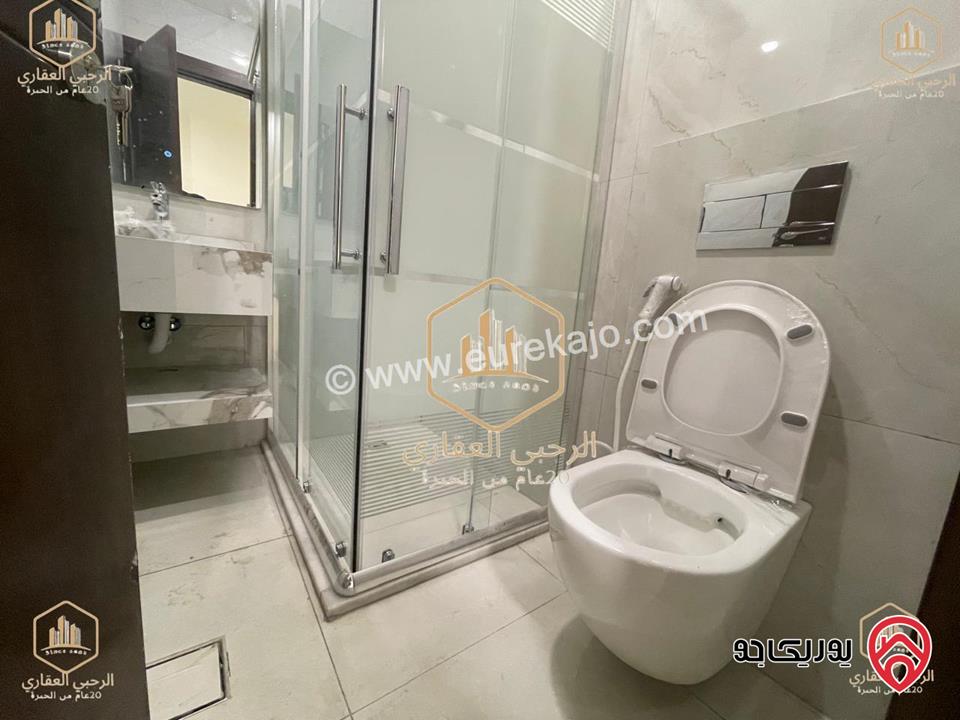 شقة ديلوكس شبه ارضية مساحة 90م مع ترس 50م للايجار في عمان - الجندويل 