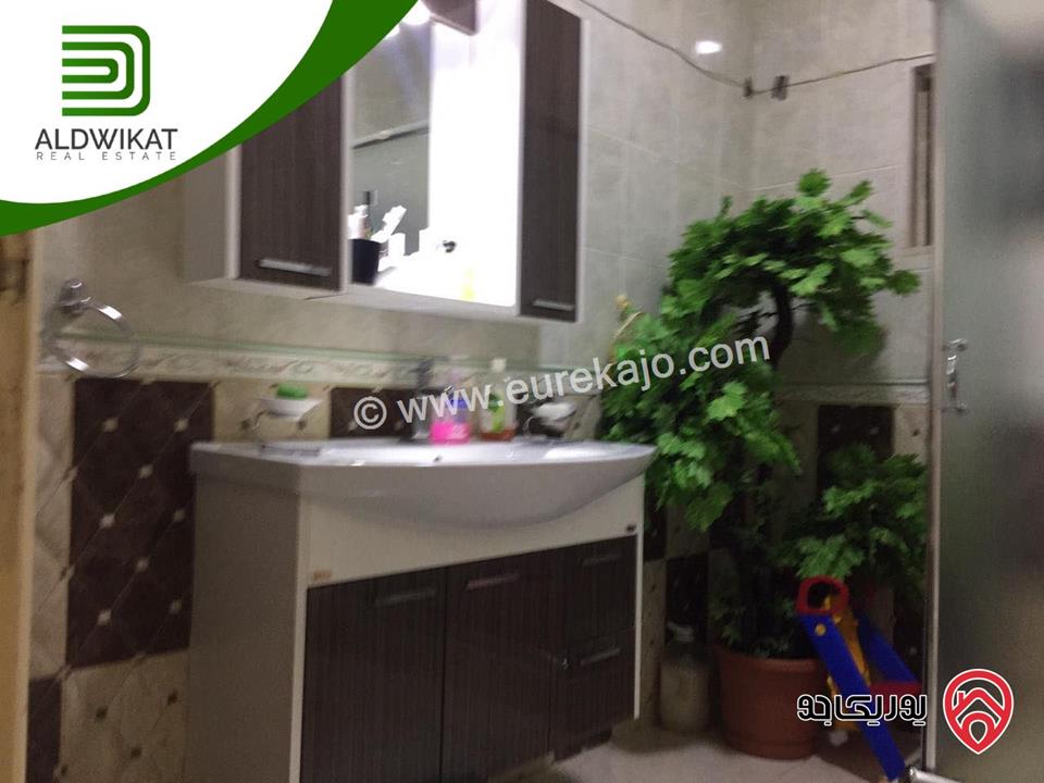 شقة شبة ارضية للبيع في عمان - المدينة الرياضية مساحة البناء 244 م مساحة الترس 30 م