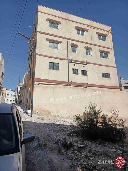 بناية سكنية على أرض 567م للبيع في الزرقاء - حي معصوم