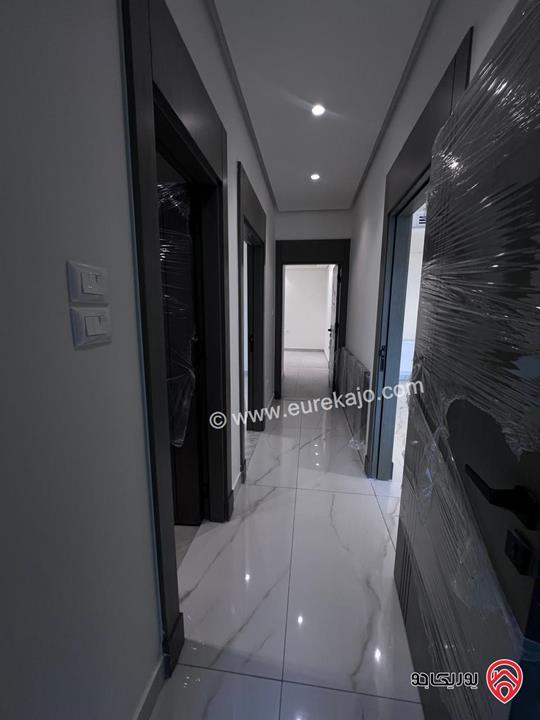 شقة جديدة طابق أول مساحة 150م للبيع في عمان - أم آذينة