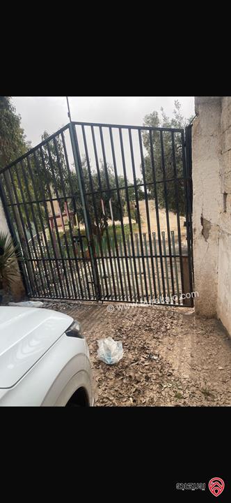 مزرعة مساحة الأرض 10 دونم والبناء 500م للبيع في عمان - منطقة وادي السير البصة ام الخنازير 