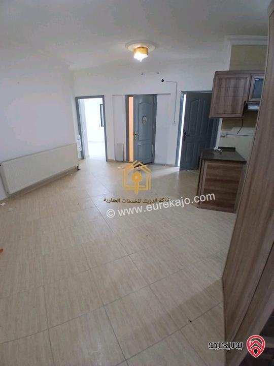 شقة فارغة طابق ارضي مساحة 100م داخلي و 30م خارجي للايجار في عمان - الدوار السابع 