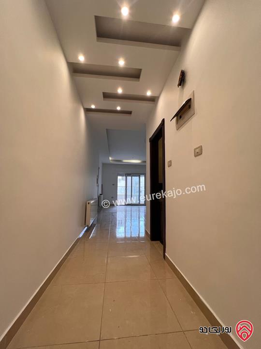 شقة شبه ارضية مساحة 110م للايجار في عمان - خلدا