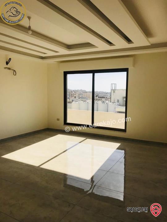 شقة فاخرة للبيع في عمان - خلدا - العوجانية قرب الهمشري طابق ثالث 200م مع روف دوبلكس 140م لم تسكن