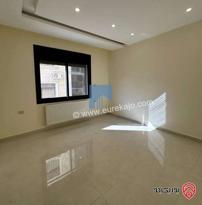 شقة أرضية فاخرة للبيع في عمان - تلاع العلي - خلف طواحين الهوا 180م مع ترس 40م لم تسكن