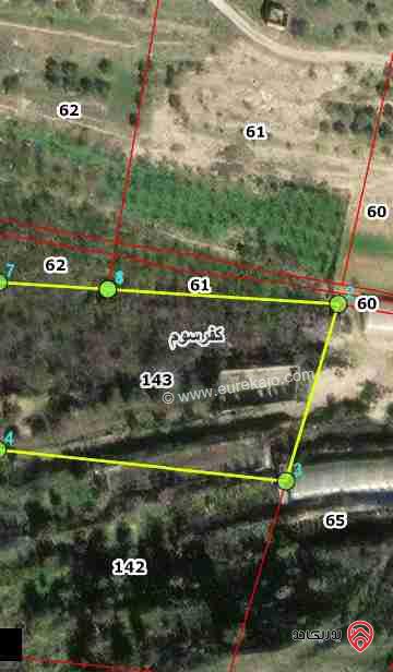 مزرعة مساحة 9 دونم مزروعة رمان و زيتون مرويه من خزان في نفس الارض للبيع في اربد - كفر سوم 