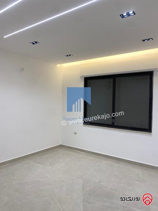 شقة أرضية فاخرة للبيع في عمان - أم أذينة قرب أبراج السادس 200م مع ترس 60م لم تسكن