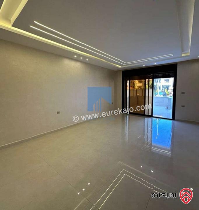 شقة أرضية فاخرة للبيع في عمان - تلاع العلي - خلف طواحين الهوا 180م مع ترس 40م لم تسكن