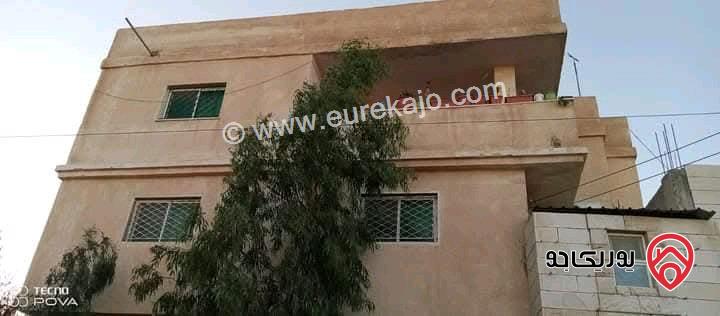 بيت مستقل ومخازن مساحة 300م على أرض 338م للبيع في عمان - ماركا الشمالية الحزام ويقبل سيارة عمومي او قطعة ارض جزء من الثمن