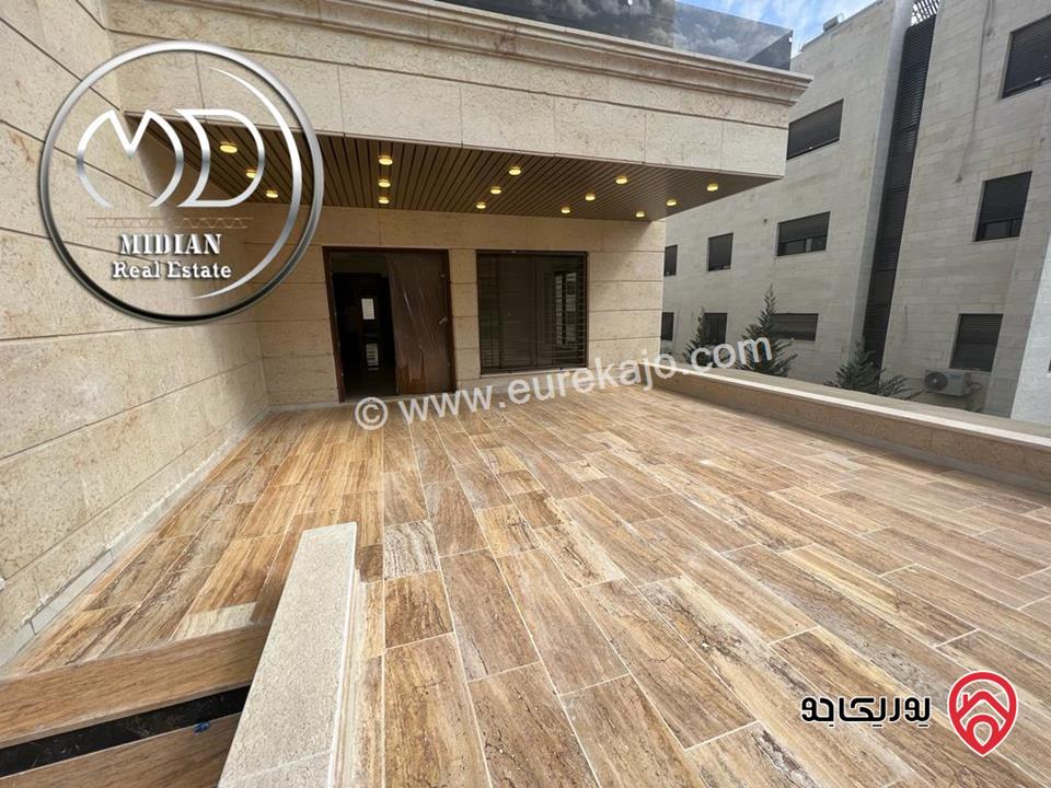 شقة ارضية للبيع في عمان - خلدا العوجانية مساحة 200م مع ترس 50م تشطيبات و ديكورات فاخرة جديدة لم تسكن
