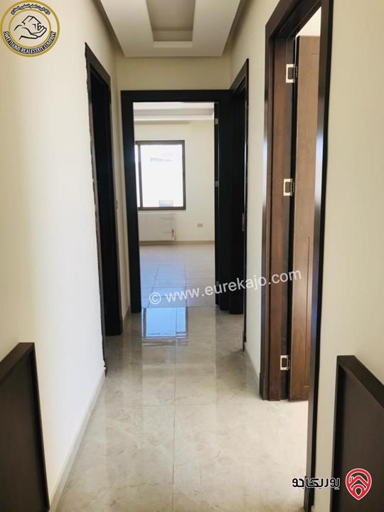 شقة فاخرة للبيع في عمان - خلدا - العوجانية قرب الهمشري طابق ثالث 200م مع روف دوبلكس 140م لم تسكن