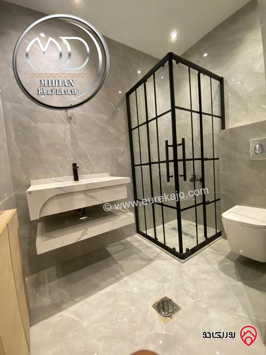 شقق شبه ارضي جديدة للبيع في عمان - الجاردنز مساحات 235م & 275م مع تراسات و حدائق تشطيبات ديكورات عصرية فاخرة