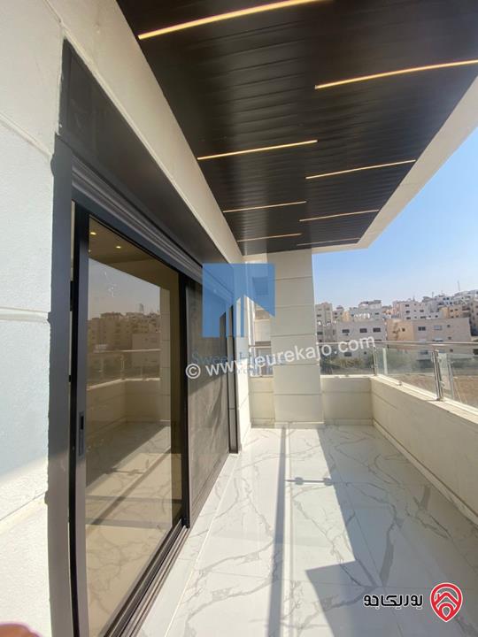 شقة فاخرة للبيع في عمان - خلدا قرب إشارة البنك العربي ومركز زها طابق ثالث 220م مع روف دوبلكس 100م لم تسكن