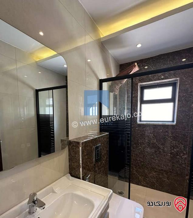 شقة أرضية فاخرة للبيع في عمان - تلاع العلي - خلف طواحين الهوا 180م مع ترس 40م لم تسكن