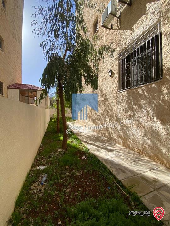 شقة أرضية مميزة  186م مع حديقة وترسات 150م للبيع في عمان - الجندويل