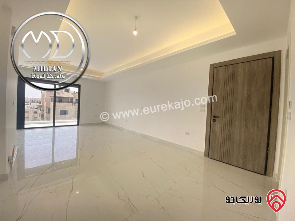 شقة دوبلكس جديدة طابق اخير مع روف للبيع في عمان - الجندويل مساحة 230م مع تراسات تشطيبات ديكورات عصرية اطلالة جميلة