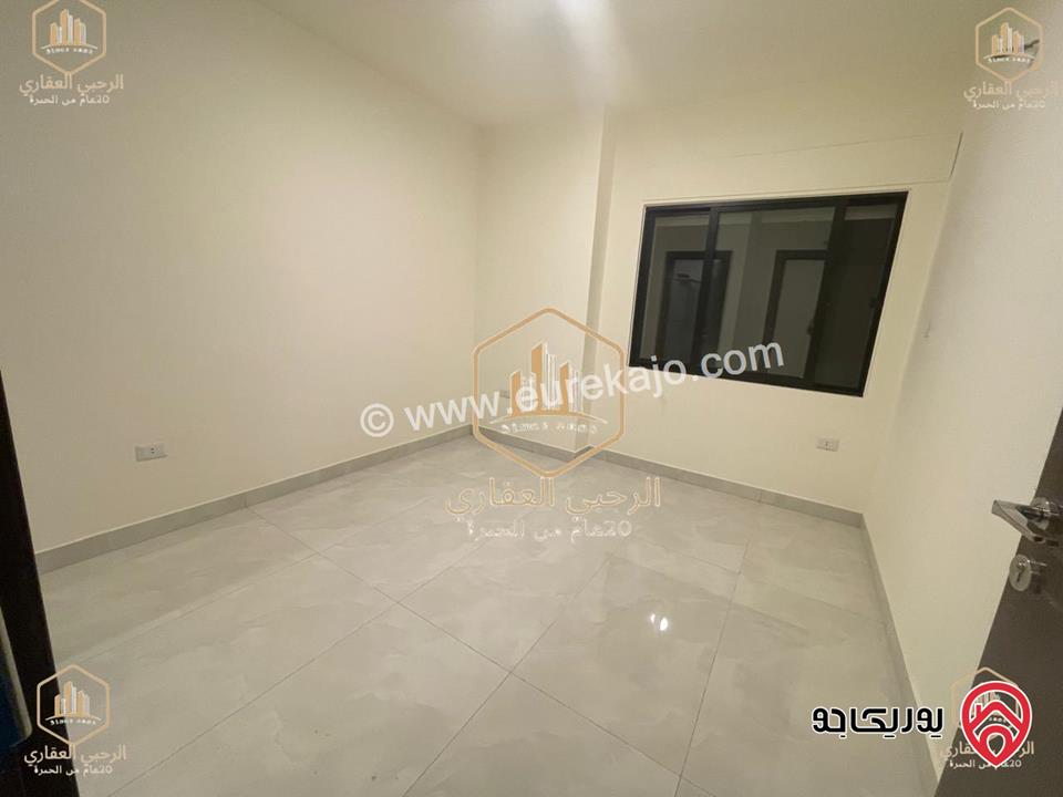 شقة ديلوكس شبه ارضية مساحة 90م مع ترس 50م للايجار في عمان - الجندويل 