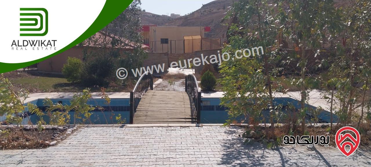 مشروع سياحي استثماري للبيع في ناعور / شارع البحر الميت مساحة الارض4650م والبناء 1000م موقع اطلالة مميز تصلح لمشروع استثماري