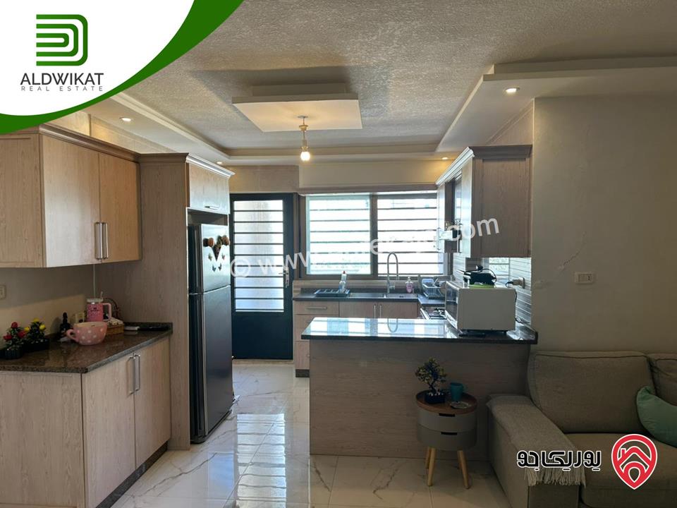 شقة شبه ارضي مفروشه للبيع في عمان - تلاع العلي المساحة الداخلية 81م والخارجية 33م موقع هادىء تشطيب حديث