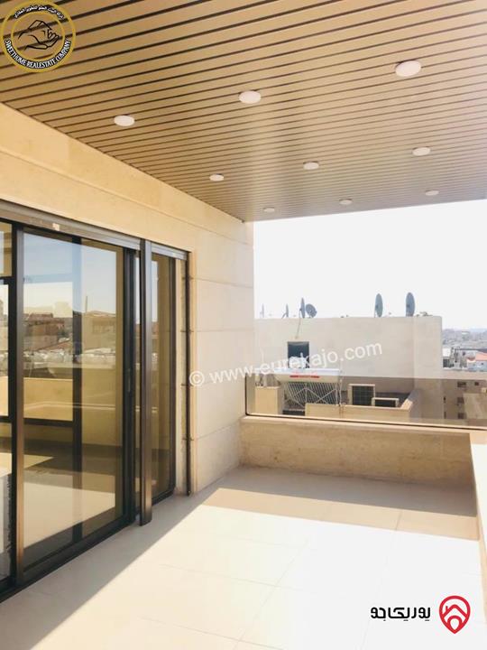 شقة فاخرة للبيع في عمان - خلدا - العوجانية قرب الهمشري طابق ثالث 200م مع روف دوبلكس 140م لم تسكن