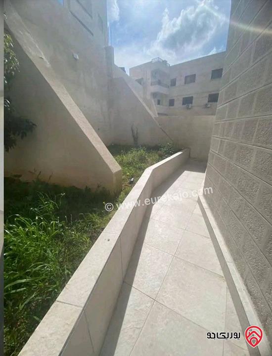 شقة فارغة طابق أول 90م مع حديقة خلفية للايجار في عمان - تلاع العلي 