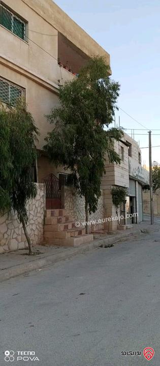 بيت مستقل ومخازن مساحة 300م على أرض 338م للبيع في عمان - ماركا الشمالية الحزام ويقبل سيارة عمومي او قطعة ارض جزء من الثمن