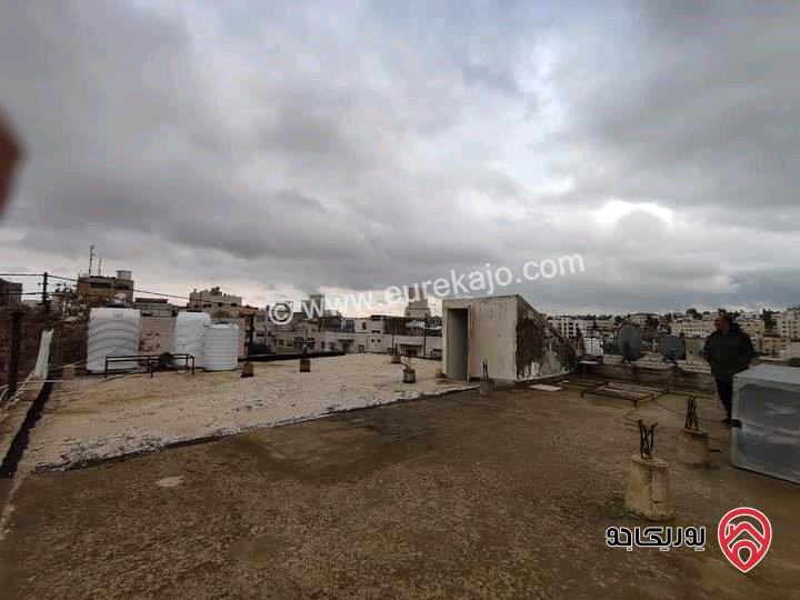 بناية سكنية وارض تحتوي على 4 شقق مقابل البوليفارد والعبدلي مول ومطلة على فندق اللاند مارك (هيلتون)  بمنطقة ممتازة للاستثمار للبيع في عمان - العبدلي