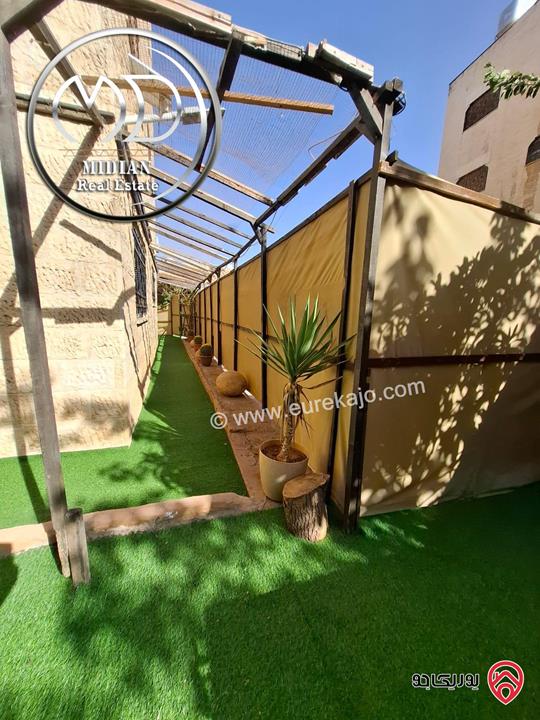 شقة شبه ارضي مفروشة للايجار في عمان - ام السماق مساحة 170م مع ترس وحديقة 150م تشطيبات سوبر ديلوكس بسعر مميز