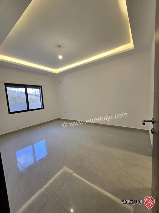 شقة أرضية مساحة 115م مع تراسات 90م للبيع في عمان - تلاع العلي