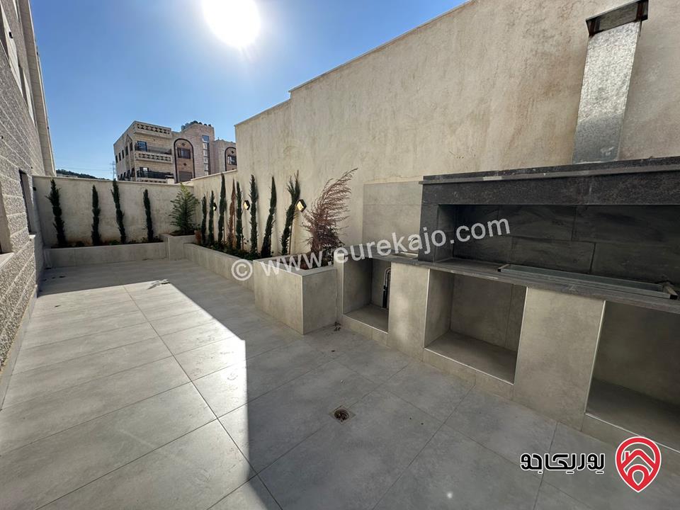 شقة جديدة طابق أرضي مساحة داخلية 138م + 110م حديقة مدخل خاص وكراج خاص وباربكيو وشلال وأحواض زراعة للبيع في عمان - ضاحية الأمير علي