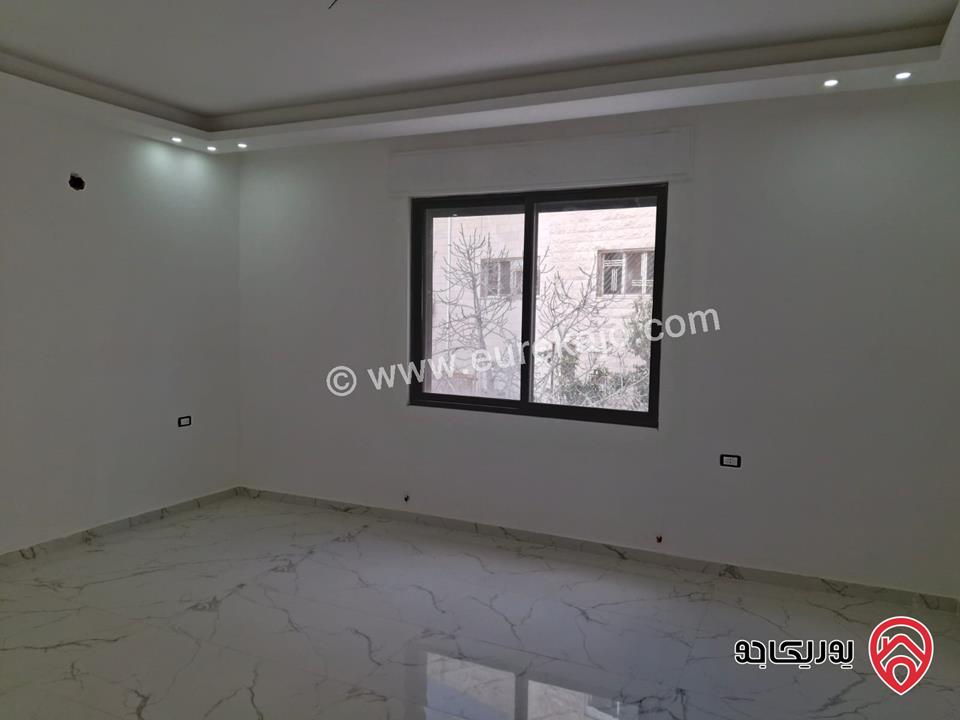 شقة جديدة طابق أول مساحة 170م للبيع في عمان - الرابية