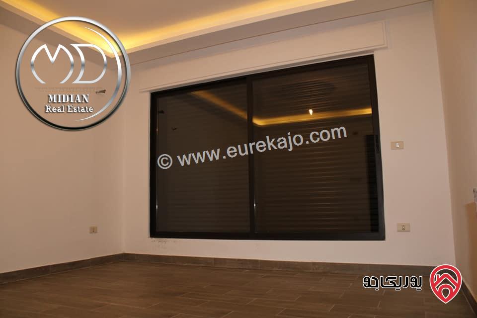 شقة ارضية جديدة للبيع في عمان - ضاحية النخيل مساحة 250م مع ترس و حديقة 150م تشطيبات و ديكورات سوبر ديلوكس