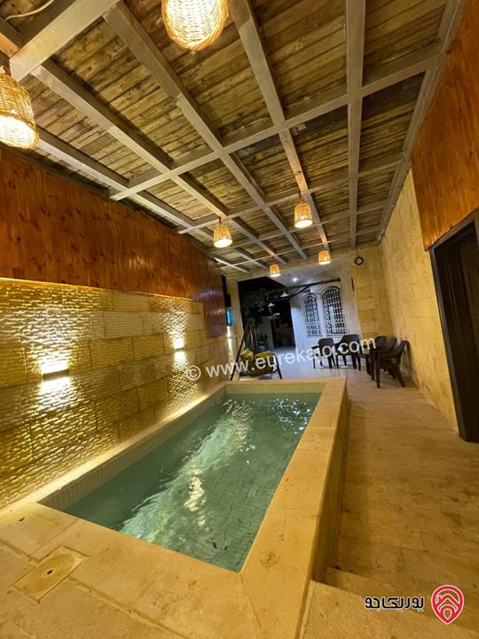 شقة مفروشة طابق ارضي مساحة 100م داخلي و 40م خارجي للايجار في عمان - الجندويل