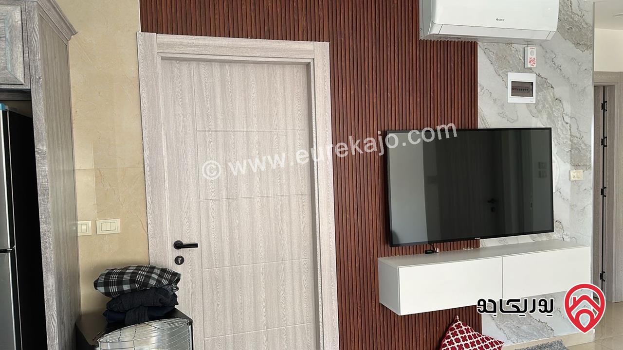 شقة طابق ارضي مساحة 125م مع ترس 30م للبيع في عمان - البنيات
