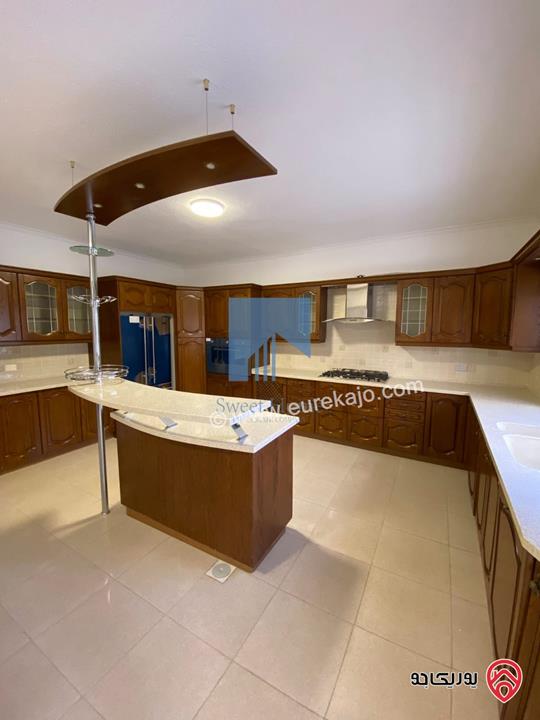 شقة أرضية (شبه فيلا) طابقية فاخرة للبيع في عمان - الرابية قرب الكالوتي 425م مع حديقة وترسات 500م