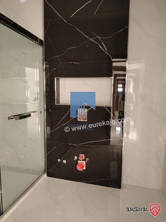 شقة فاخرة للبيع في عمان - خلدا قرب المدارس الإنجليزية طابق ثالث 280م مع روف دوبلكس 180م لم تسكن