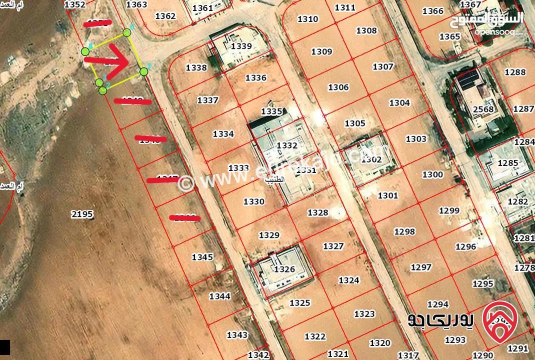 قطعة ارض مساحة 498م للبيع من أراضي جنوب عمان - الطنيب واجهة على الشارع منطقة فلل ومطلة على جامعة الاسراء