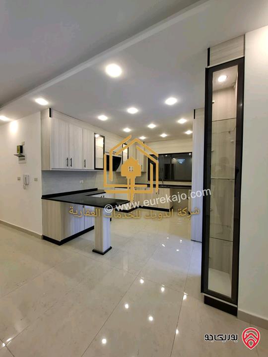 شقة جديدة طابق أرضي مع حديقة مساحه 150م داخلي 130م حديقة للايجار في عمان - الجندويل 