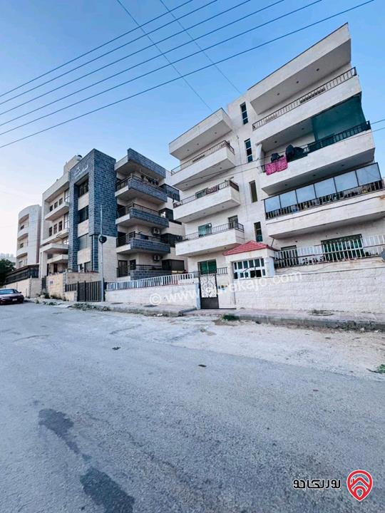 عمارة مكونة من 10 شقق مؤجرة للبيع في مادبا حنينا