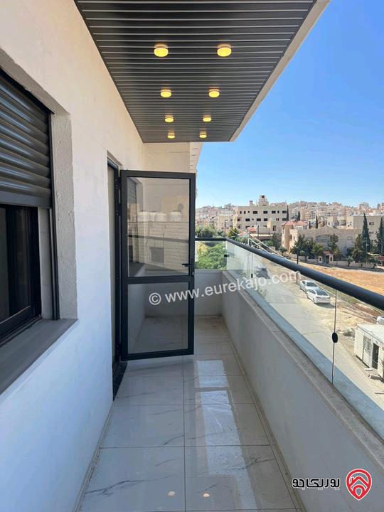 شقة طابق أخير مع روف مساحة 190م للبيع في عمان - طبربور بالقرب من دوار الدبابه