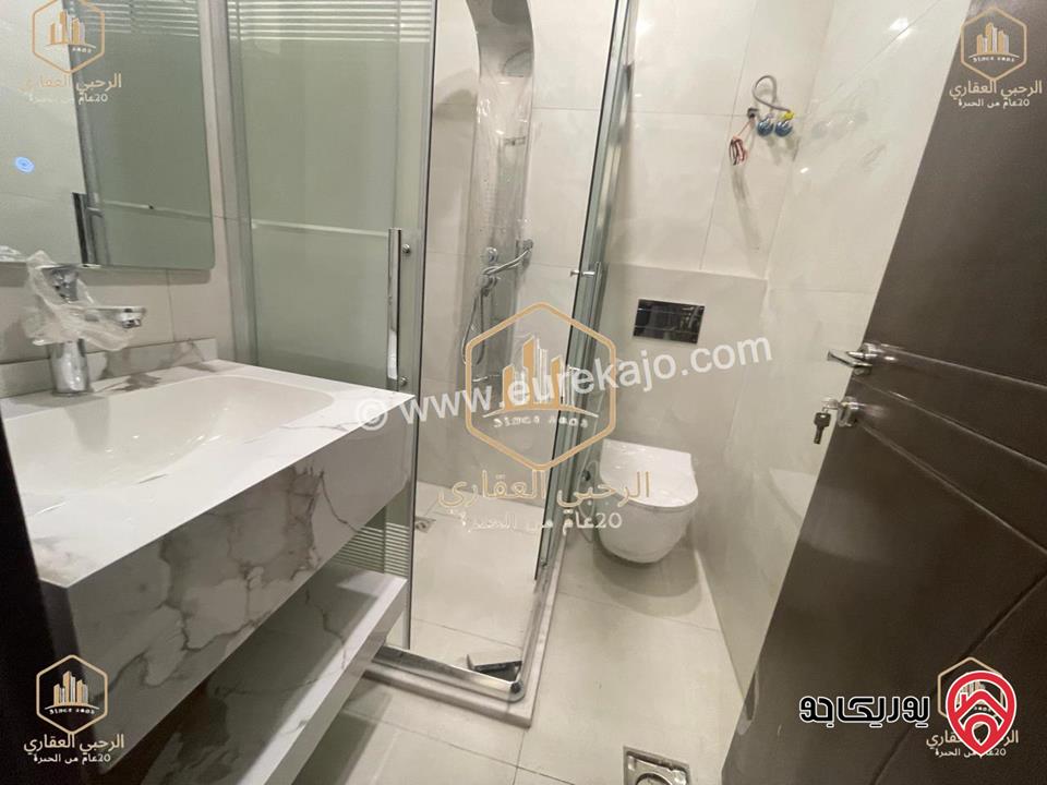 شقة ديلوكس شبه ارضية مساحة 90م مع ترس 50م للايجار في عمان - الجندويل 