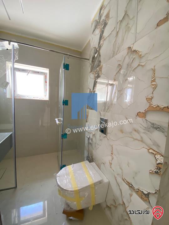 شقة أرضية فاخرة للبيع في عمان خلدا - قرب إشارة البنك العربي 175م مع ترسات 200م لم تسكن