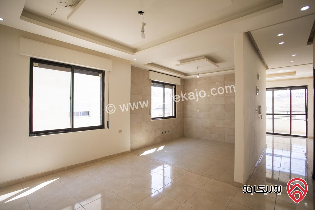 شقة طابق ثالث مع روف مساحة 135م للبيع في عمان - ابو علندا 